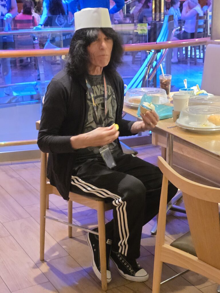 Decorating Cupcakes with Quiet Riot! Person eating with paper hat